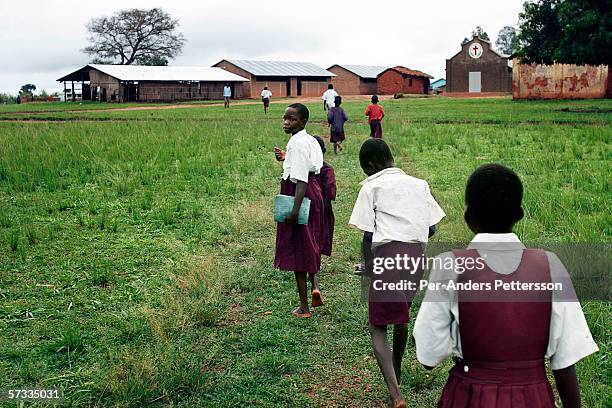 uga: night commuters - native african girls stock pictures, royalty-free photos & images