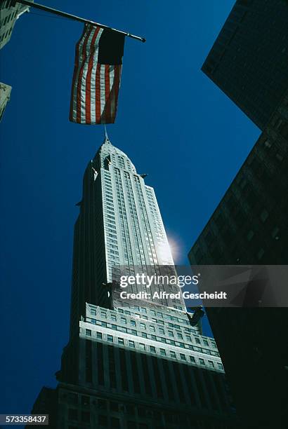The Chrysler Building in New York City, with the Stars and Stripes flying in front of it, April 1986.