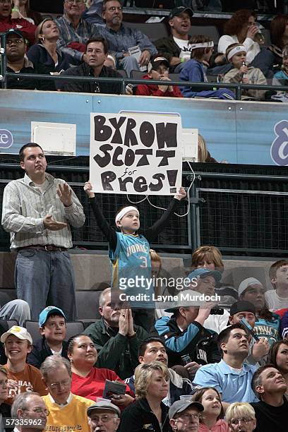 Young boy in the stands holds up sign saying "Byron Scott for Pres" during a game of the New Orleans/Oklahoma City Hornets against the Houston...