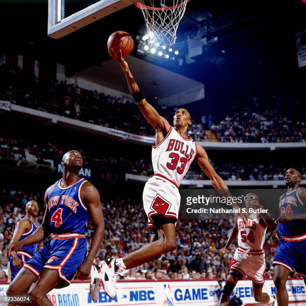 Scottie Pippen of the Chicago Bulls shoots a layup against Anthony Bonner of the New York Knicks at United Center on April 24, 1994 in Chicago,...