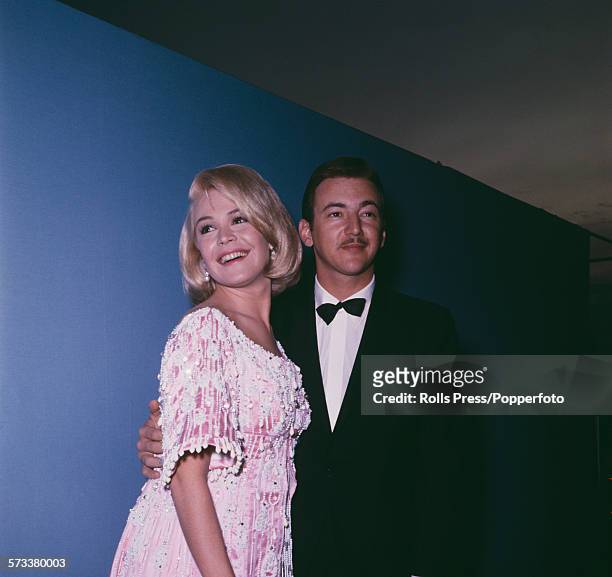 American singer and actor, Bobby Darin pictured with his wife, actress Sandra Dee at the 37th Academy Awards or Oscars at the Santa Monica Civic...