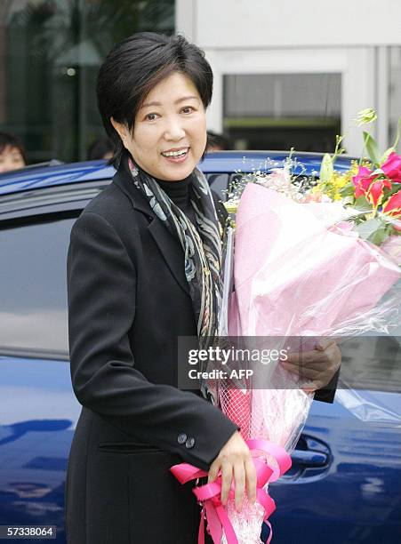 Japan's Environment Minister Yuriko Koike, who was hospitalized for treatment of acute pneumonia, appears to the press as she is discharged from...