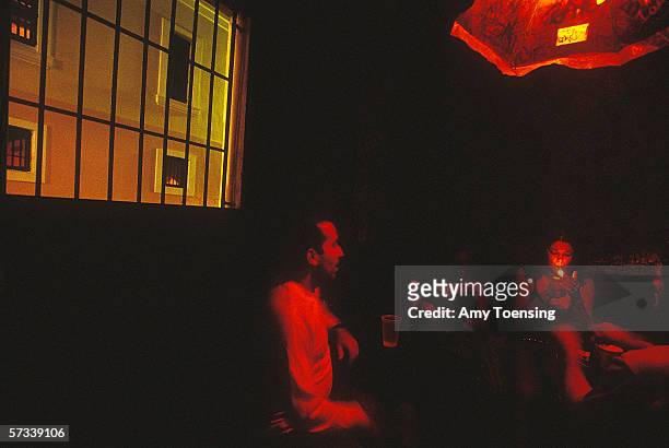 Young people socialize in a bar on October 10, 2001 in Old San Juan, Puerto Rico. Old San Juan is known as a destination for young Puerto Ricans to...