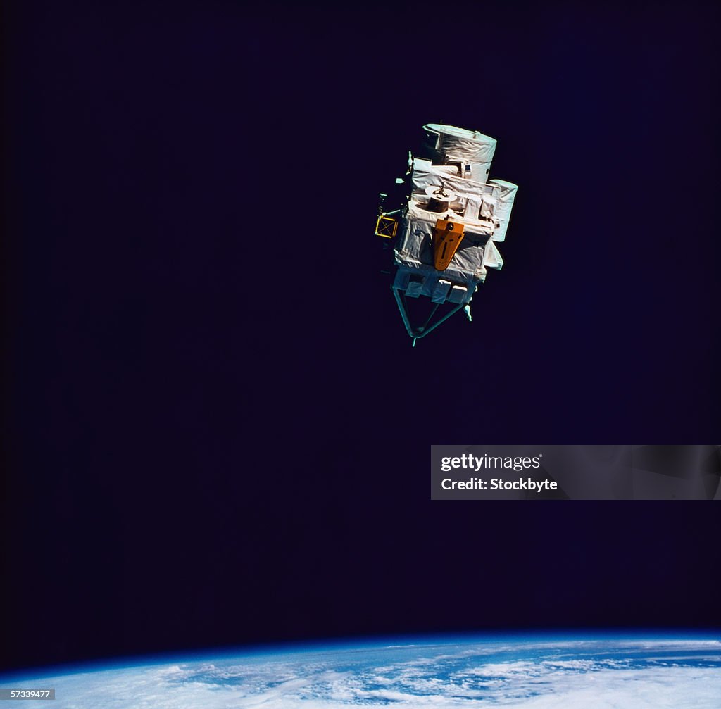 View of a manmade satellite in orbit above the earth