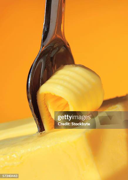 close-up of a butter curl - butter curl stock pictures, royalty-free photos & images