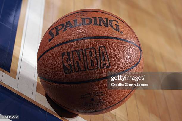 Close up view of the official NBA logo on a Spalding basketball as it rests on the court during a game between the Golden State Warriors and the...