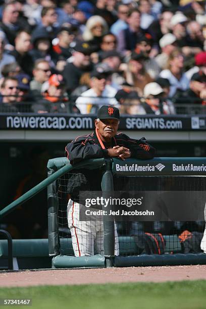 Manager Felipe Alou of the San Francisco Giants watches from the dugout against the Atlanta Braves during the home opener at AT&T Park on April 6,...