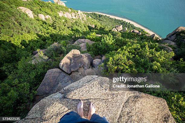 pov of a man standing on the edge of a cliff - cliff stock pictures, royalty-free photos & images