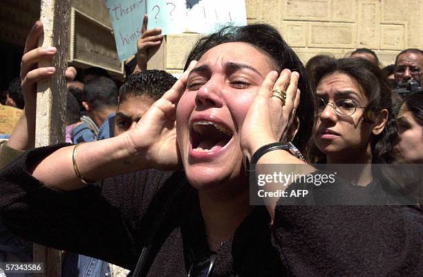 An Egyptian Coptic Christian woman cries 15 April 2006 during the funeral of a fellow Copt who was stabbed yesterday during a church service in the...