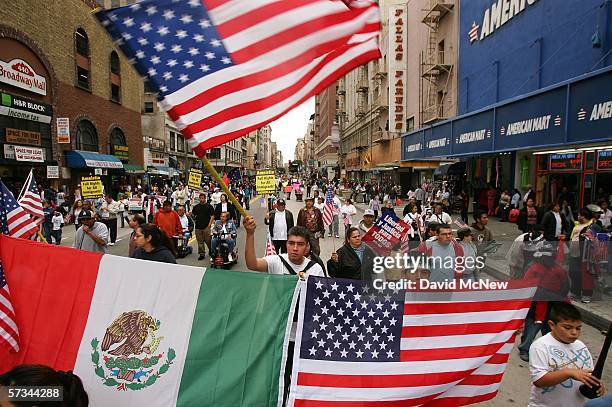 Demonstrators carry the flags of Mexico and the US as students and supporters march to call for amnesty for illegal immigrants on April 15, 2006 in...