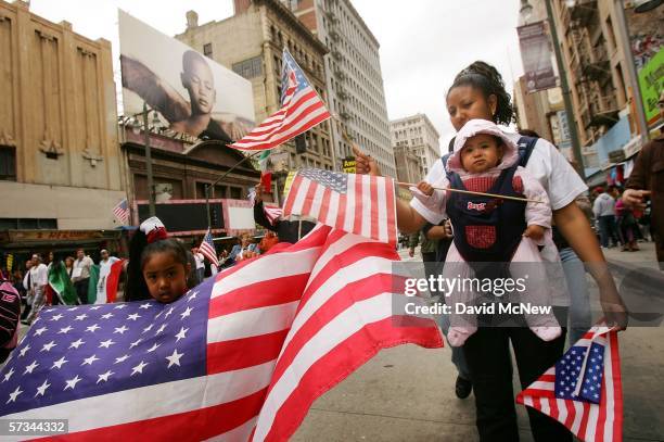 Rebecca Castillo, a student and pre-school teacher at USC, walks with her daughters, four-year-old Britney and eight-month-old Sheila, in a student...