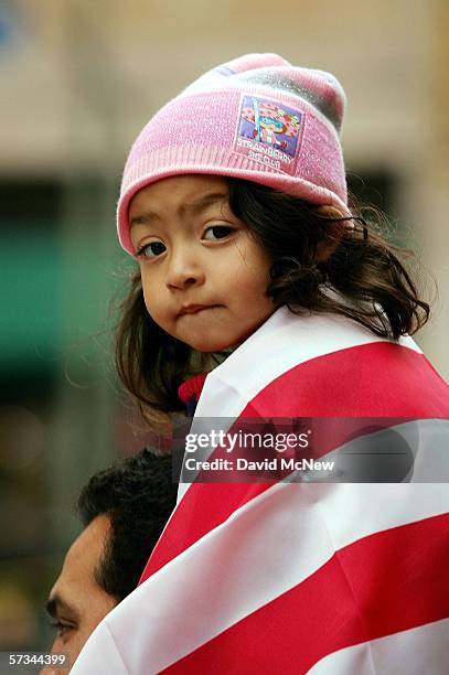 Three-year-old Lara Lopez gets an elevated view from the shoulders of her father Albero during a student rally on April 15, 2006 in Los Angeles,...