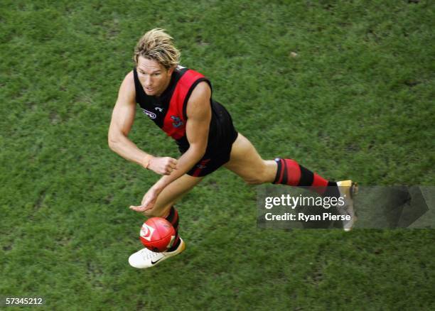 James Hird of the Bombers handballs during the round three AFL match between the Essendon Bombers and the Western Bulldogs at the Telstra Dome April...