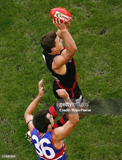 Matthew Lloyd of the Bombers marks over Brian Harris of the Bulldogs during the round three AFL match between the Essendon Bombers and the Western...