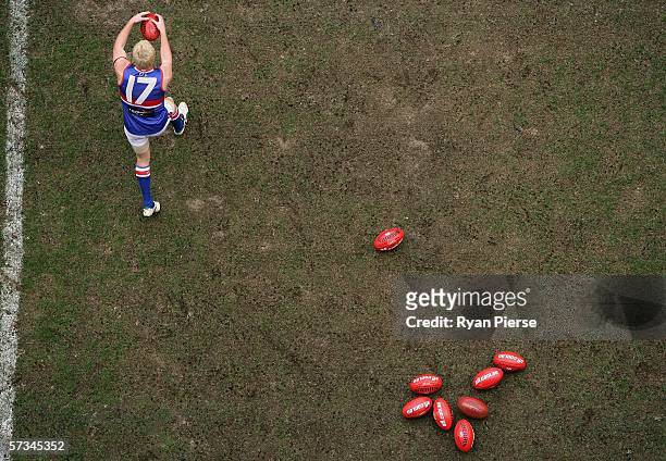 Adam Cooney of the Bulldogs warms up before the round three AFL match between the Essendon Bombers and the Western Bulldogs at the Telstra Dome April...