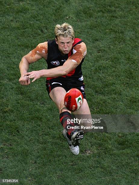 Mark Johnson of the Bombers kicks during the round three AFL match between the Essendon Bombers and the Western Bulldogs at the Telstra Dome April...
