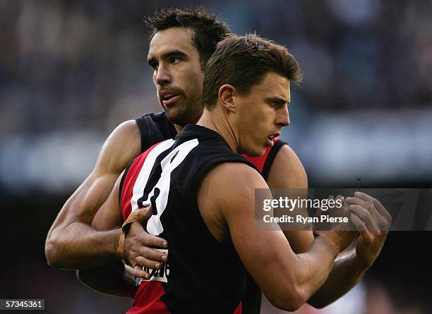 Scott Lucas and Matthew Lloyd of the Bombers celebrate a goal during the round three AFL match between the Essendon Bombers and the Western Bulldogs...