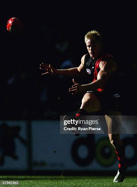 Adam McPhee of the Bombers kicks during the round three AFL match between the Essendon Bombers and the Western Bulldogs at the Telstra Dome April 16,...