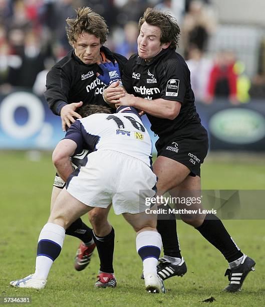 Jonny Wilkinson and James Grindal of Newcastle tackle Andy Titterall of Sale during the Guinness Premiership match between Newcastle Falcons and Sale...