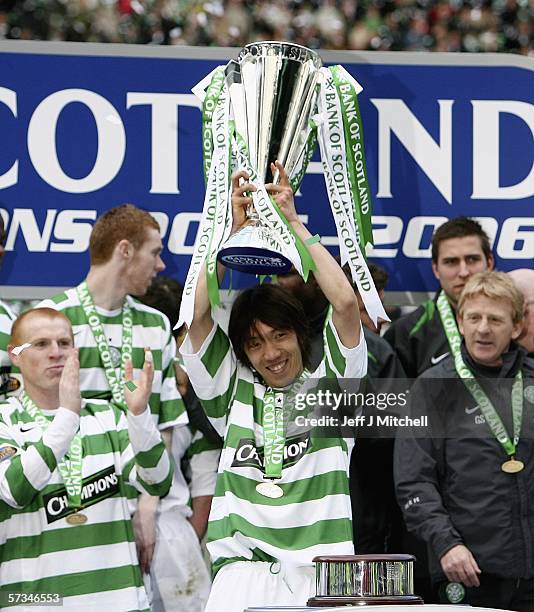 Shunsuke Nakamura of Celtic lifts the Scottish Premier division trophy after the match between Celtic and Hibernian at Celtic Park April 16 Glasgow...