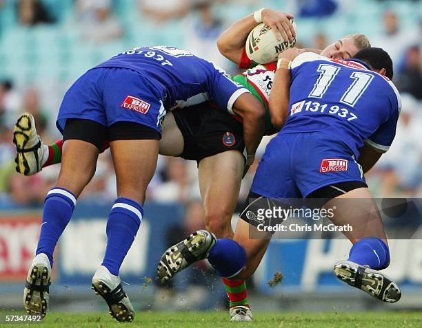Shannon McPherson of the Rabbitohs is up ended by Willie Mason of the Bulldogs during the round six NRL match between the Bulldogs and the South...