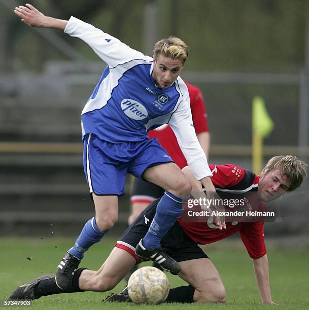 Huesein Kuday of Karlsruhe competes with Tim Hofmann of Hanover during the DFB Juniors German Cup semi final match between Karlsruher SC and Hanover...