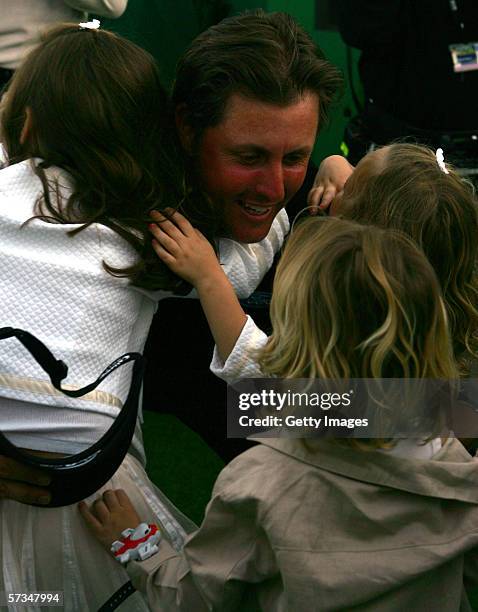 Phil Mickelson is congratulated by his daughters Sophia and Amanda, and son Evan after his 7-under par victory during the Final Round of The Masters...