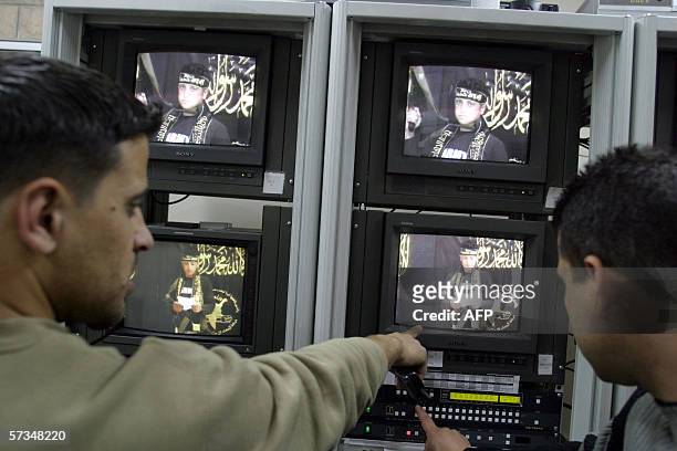 Technicians working for a media company run the video tape showing suicide bomber Sami Salim Hamadah giving his last testimony prior to blowing...