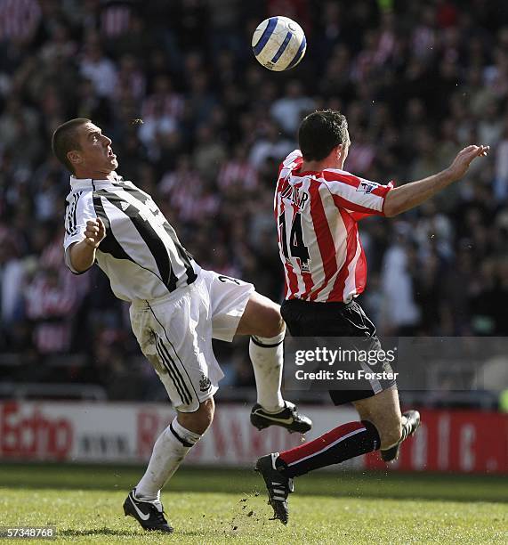 Newcastle midfielder Lee Clark is beaten to the ball by Tommy Miller during the Barclays Premiership match between Sunderland and Newcastle United at...