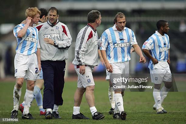 Brighton players walk off at full time after their team are relegated to division one after the Coca-Cola Championship match between Brighton & Hove...