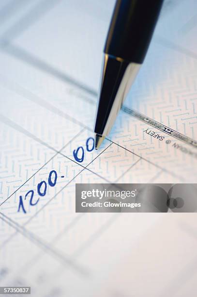 close-up of numbers written on a bank deposit slip - bank deposit slip fotografías e imágenes de stock