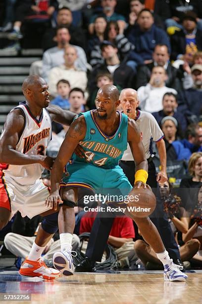 Marc Jackson of the New Orleans/Oklahoma City Hornets moves the ball against the Golden State Warriors during the game at the Arena in Oakland on...