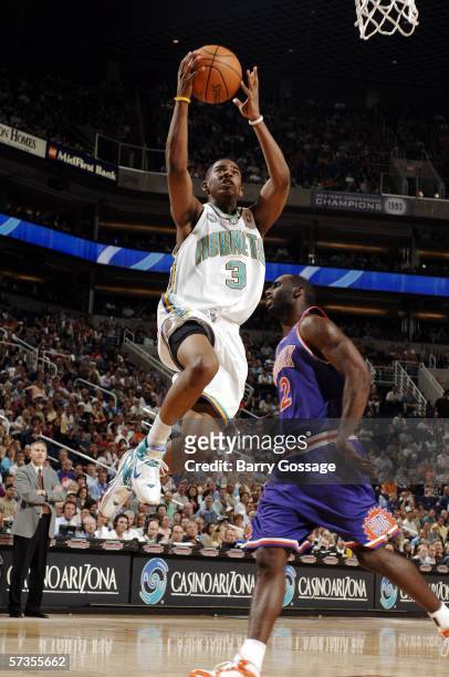 Chris Paul of the New Orleans/Oklahoma City Hornets goes up for a layup on a turnover against the Phoenix Suns in NBA action April 17 at U.S. Airways...