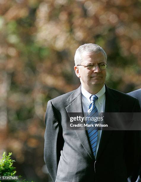 White House Chief of Staff Joshua B. Bolten watches as U.S. President George W. Bush nominates U.S. Trade Representative Robert Portman to be...