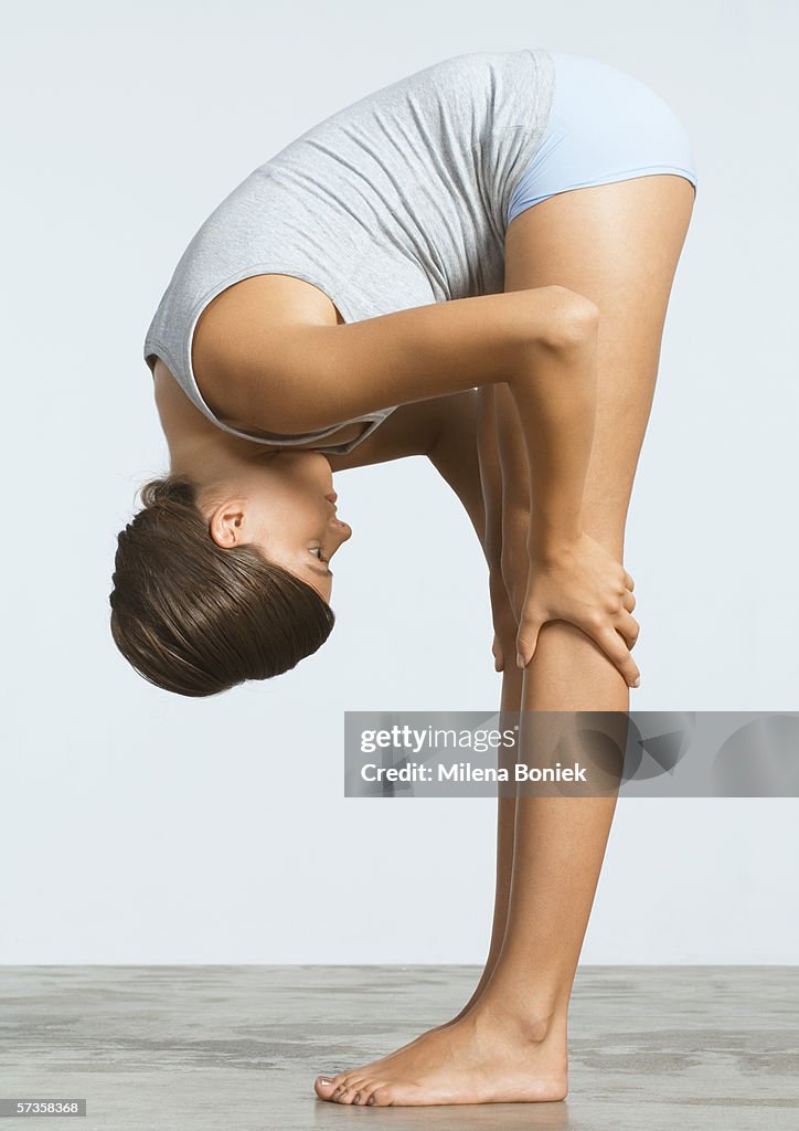Woman doing forward bend