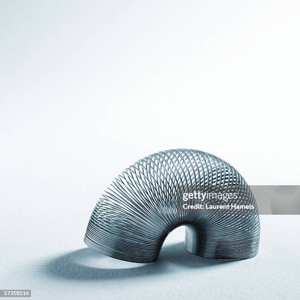 slinky - metal coil stock pictures, royalty-free photos & images