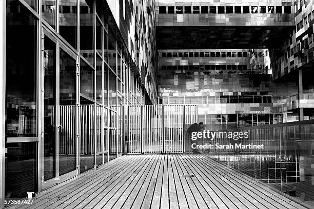 a man taking picture in front of a building - hérault stockfoto's en -beelden