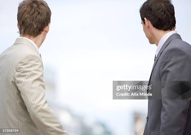 two businessmen looking into the distance, rear view - turning back stock pictures, royalty-free photos & images