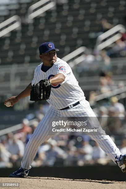 Carlos Zambrano of the Chicago Cubs pitches during a Spring Training game against the Oakland Athletics at Hohokam Stadium on March 2, 2006 in Mesa,...