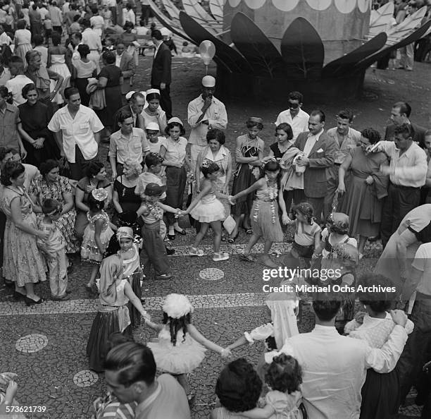 View of the carnival parade revelers party and dance on the street during Carnival in Rio De Janeiro, Brazil.