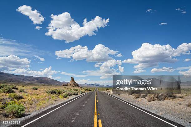 straight nevada highway - nevada stock pictures, royalty-free photos & images