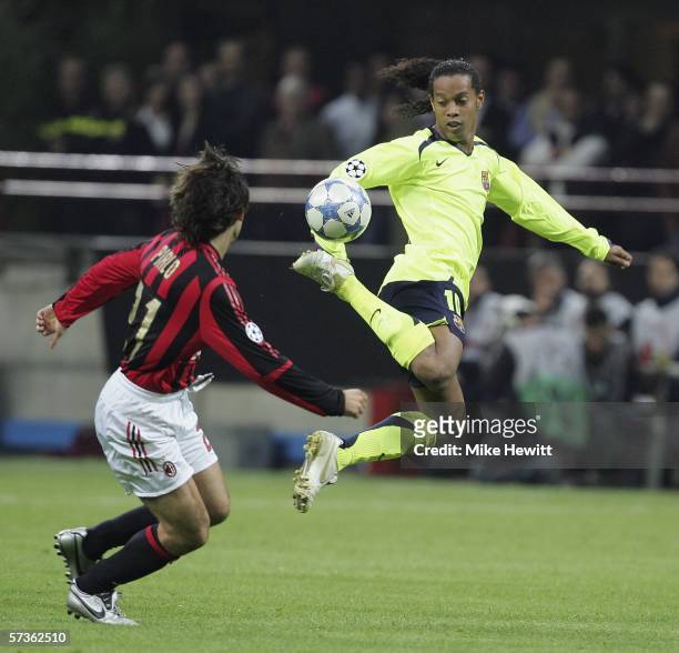 Ronaldinho of Barcelona uses a bit of magic to bamboozle Andrea Pirlo of Milan during the UEFA Champions League Semi Final first leg match between AC...