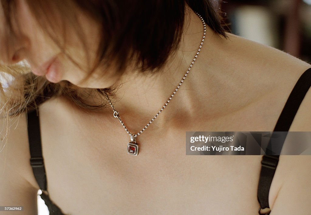 A woman wearing a necklace