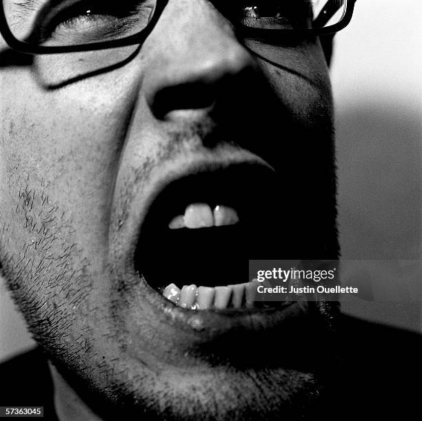 close-up of young man with mouth open - man angry mouth stock pictures, royalty-free photos & images
