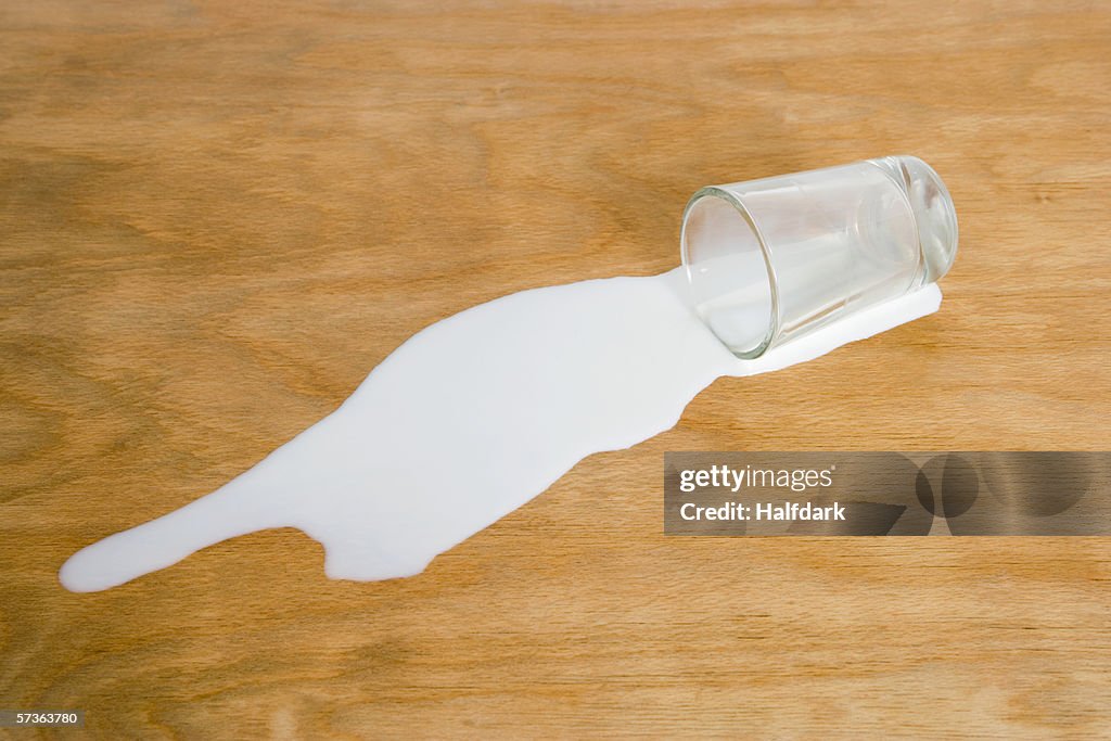 A glass of spilled milk