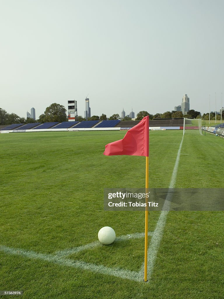 A soccer ball lined up for a corner kick