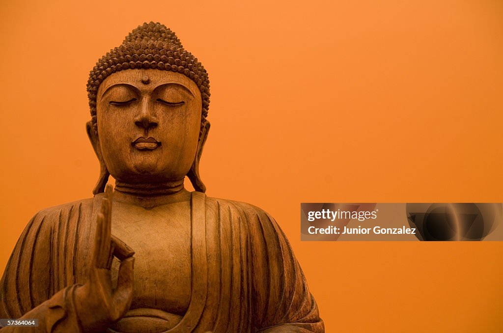 Wooden carving of Buddha