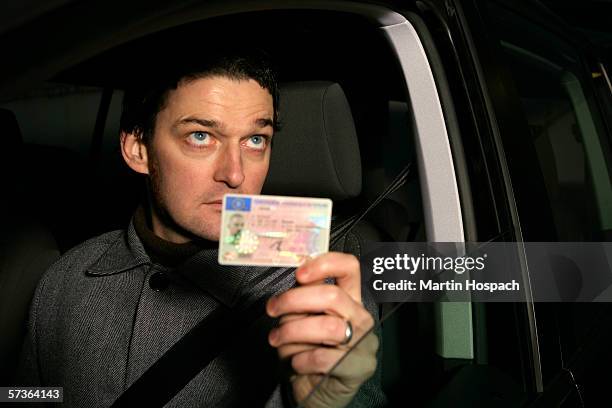 man sitting in car and holding his id card - pulled over by police stock pictures, royalty-free photos & images