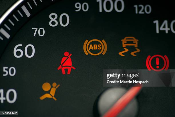 car speedometer with illuminated seat belt sign - armaturenbrett stock-fotos und bilder