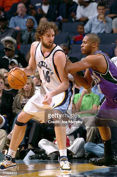 Pau Gasol of the Memphis Grizzlies is defended by Jamaal Magloire of the Milwaukee Bucks on April 7, 2006 at the FedExForum in Memphis, Tennessee....